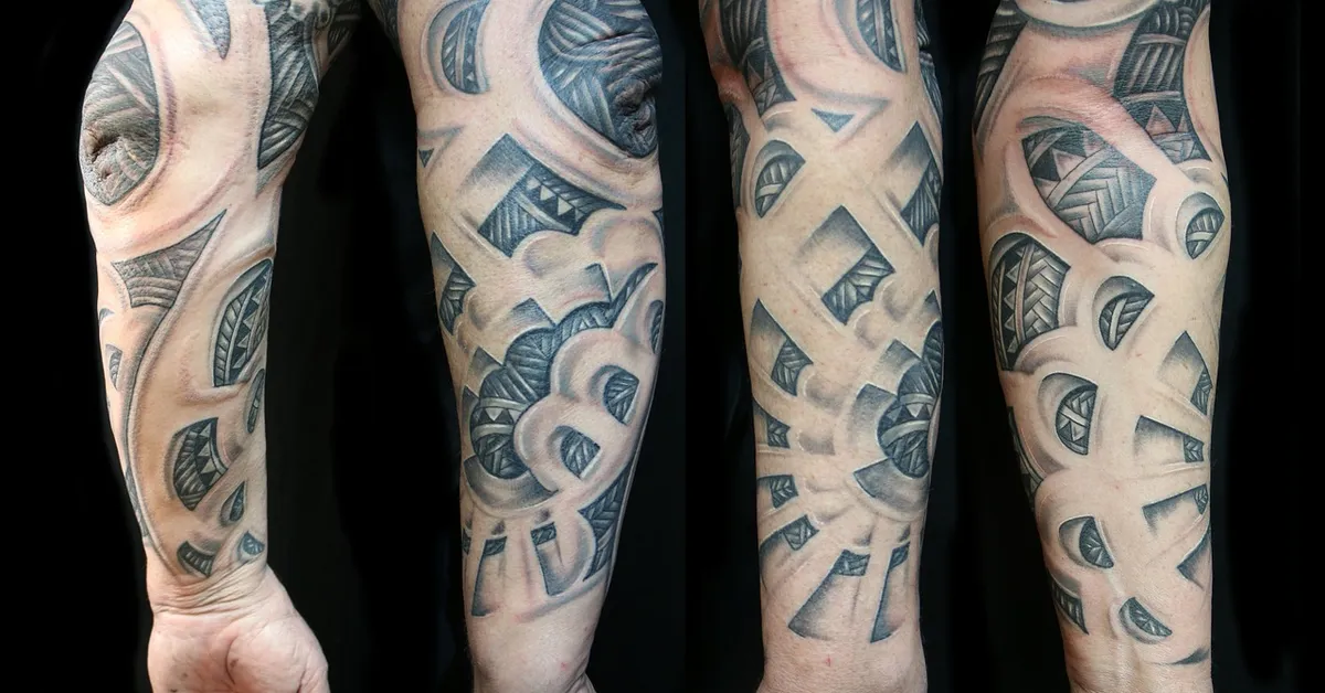 Close-up of several arms with blue-gray geometric sleeve tattoos extending from the wrist to the upper arm.