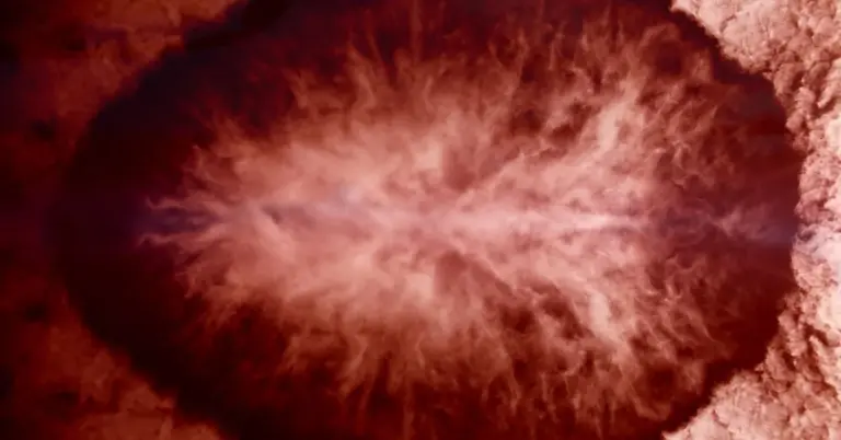 Close-up of a plasma pen treatment in progress, showing a bright plasma plume near the skin.